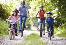 Happy family riding bikes