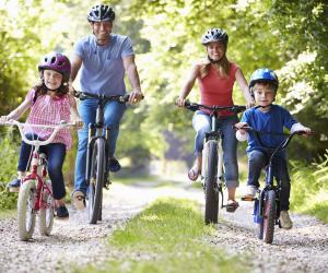 Happy family riding bikes